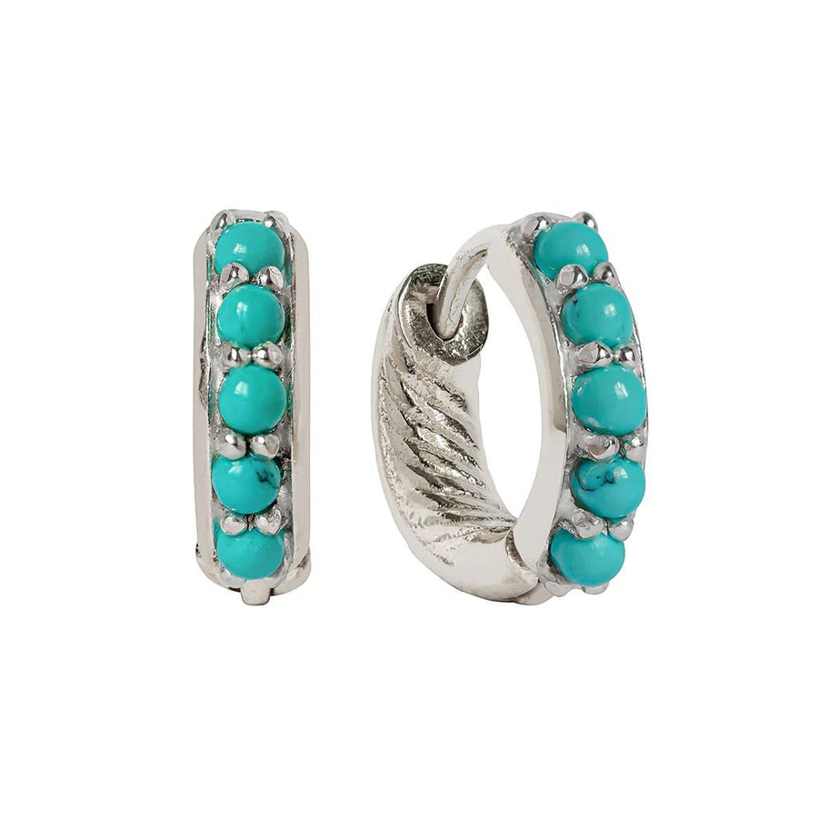 Niche Jewellery Charlotte's Web Kali huggie hoops in recycled silver featuring a row of vibrant turquoise stones.