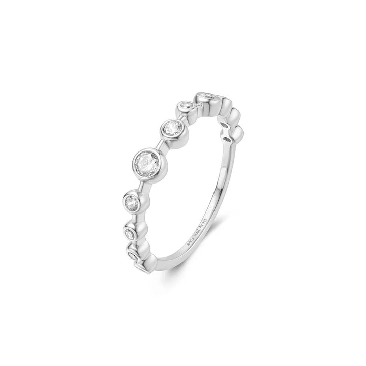 Niche Jewellery Ania Haie sterling silver zig-zag ring with bezel-set cubic zirconia stones on a white background