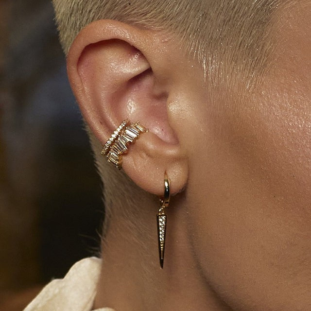 Niche Jewellery Scream Pretty slim silver ear cuff with sparkling baguette stones worn on a model's ear