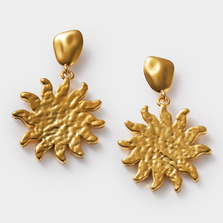 Niche Jewellery: Katie Loxton Solesi Sun Waterproof Gold Earrings featuring a textured sun charm with 18K Gold PVD coating.
