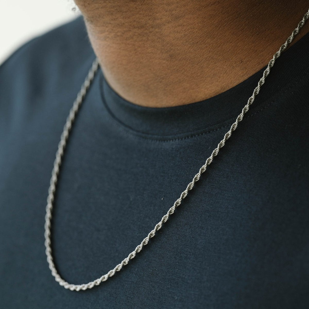 Niche Jewellery thin stainless steel twisted rope chain necklace worn on a person in a black t-shirt