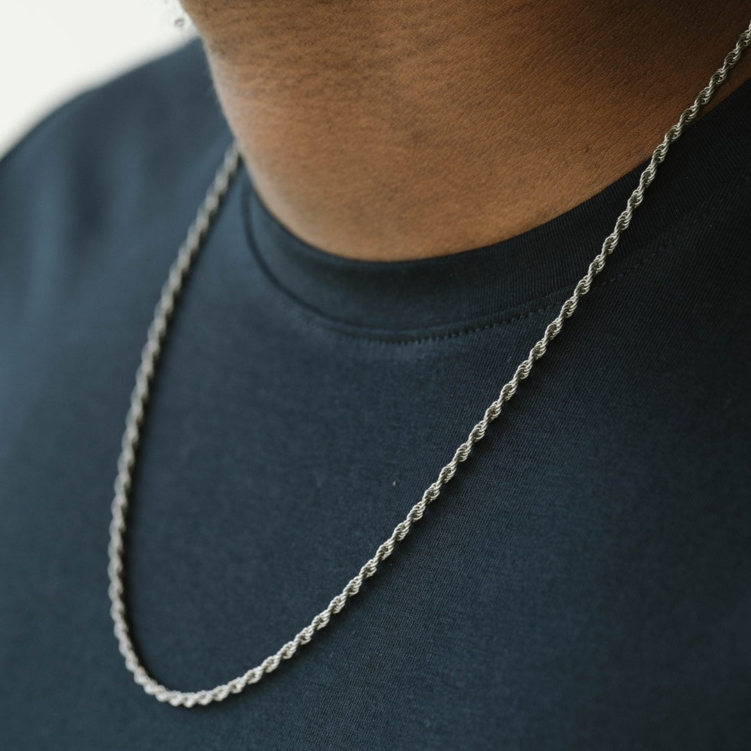 Niche Jewellery thin stainless steel twisted rope chain necklace worn on a person in a black t-shirt