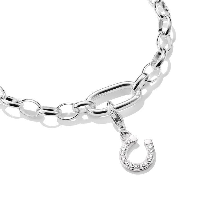 Niche Jewellery Sterling Silver Horseshoe Charm Pendant with white zirconia, on a charm bracelet.