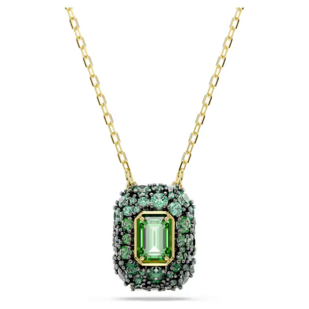 Niche Jewellery Swarovski Sublima pendant featuring an octagon-cut green crystal with gold-tone chain and accents.