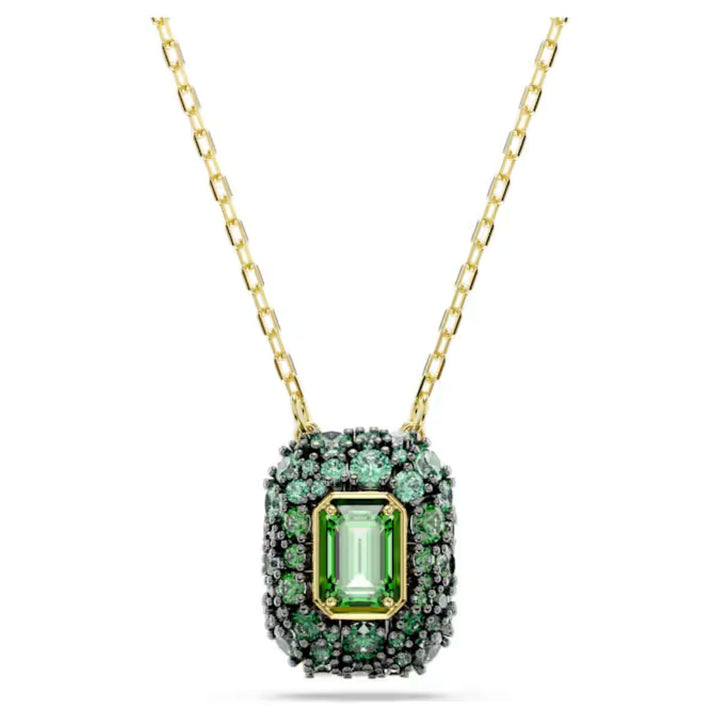 Niche Jewellery Swarovski Sublima pendant featuring an octagon-cut green crystal with gold-tone chain and accents.