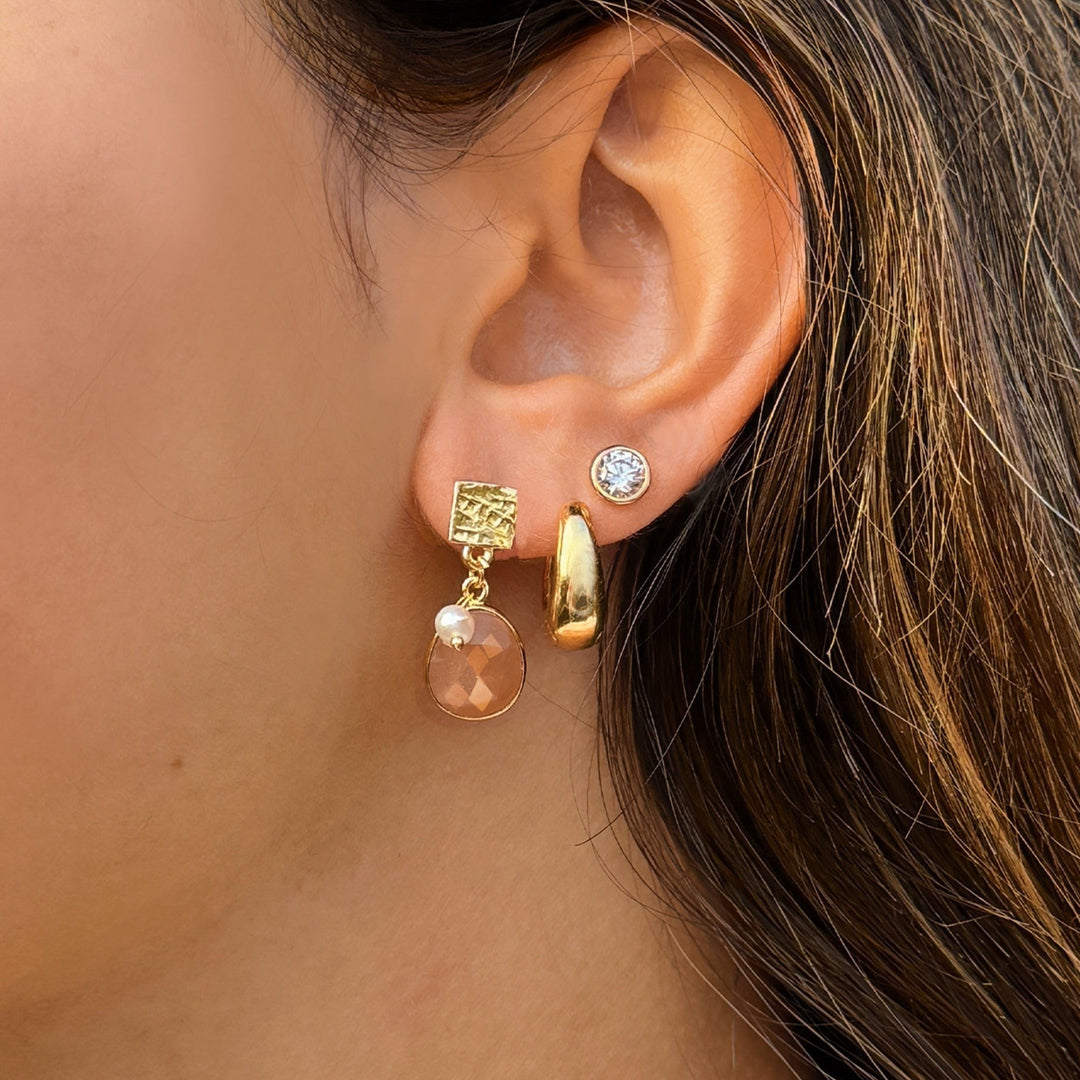 Niche Jewellery Sarah Alexander Sunset Vibes earrings featuring peach moonstone, pearl, and 18ct gold-plated charms.