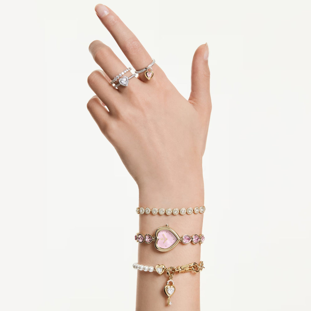 Niche Jewellery Swarovski Una Angelic bracelet with clear crystals and gold-tone plating worn on a woman's wrist