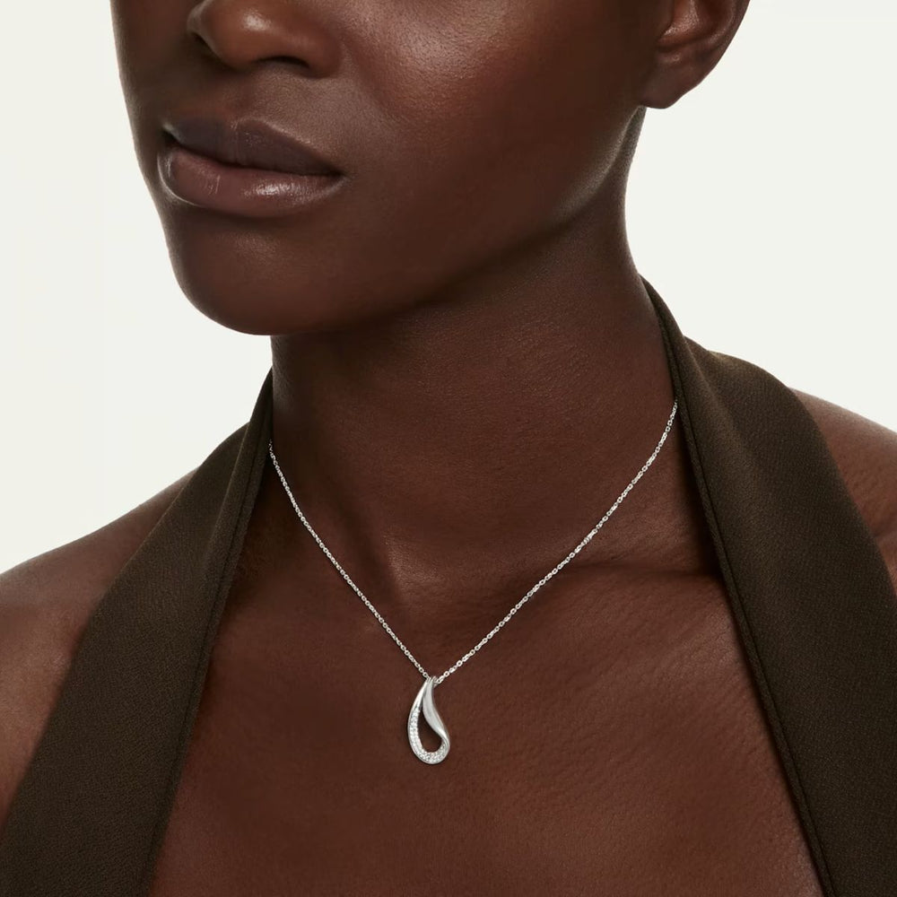 Niche Jewellery Swarovski Classica sterling silver pendant necklace with a round cut zirconia stone on a model