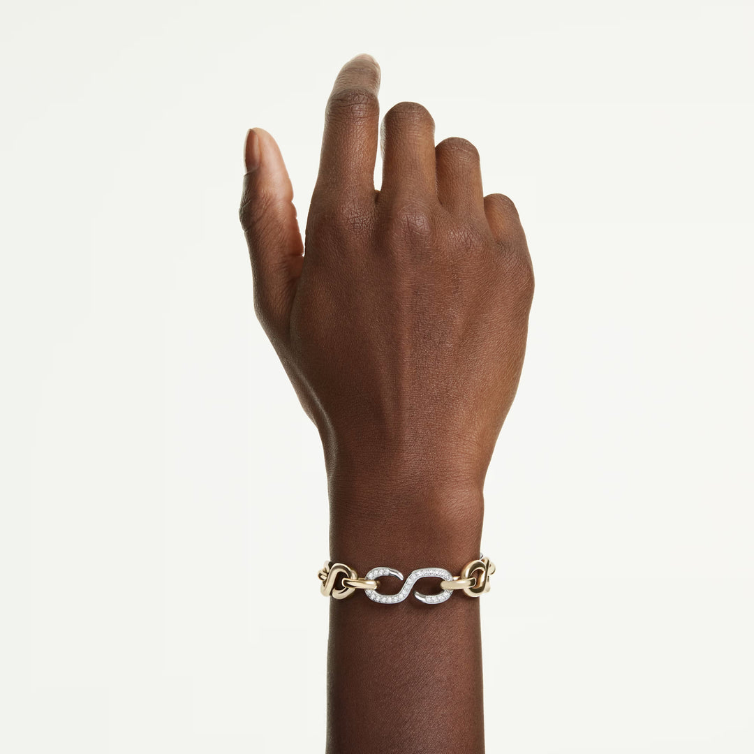 Niche Jewellery Swarovski Dextera bracelet featuring round-cut white crystals on a mixed gold and silver tone chain.
