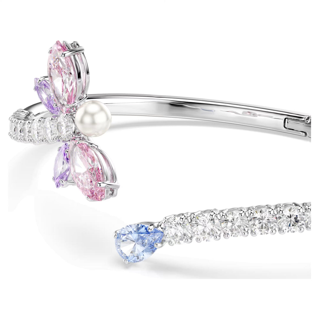 Niche Jewellery Swarovski x Ariana Grande rhodium-plated bangle featuring a multicolored crystal dragonfly and pearl.