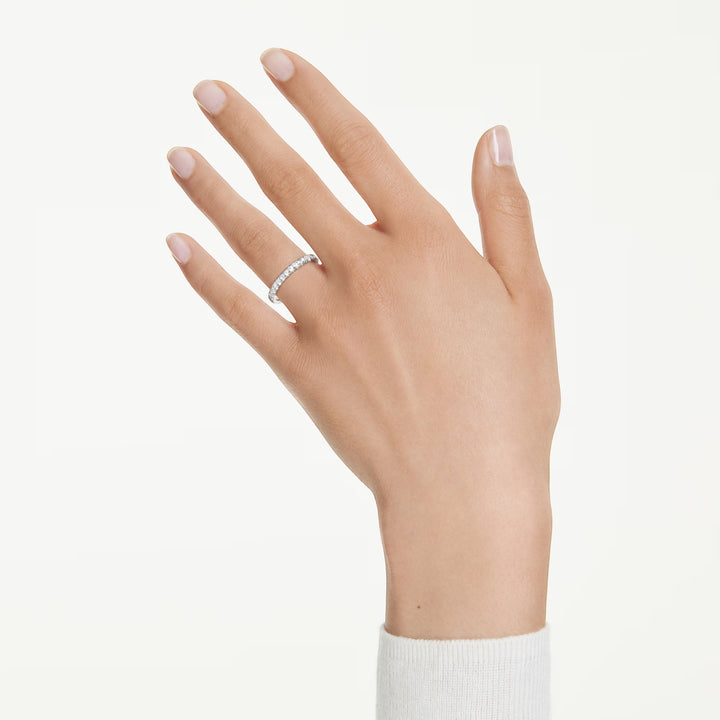 Niche Jewellery Swarovski eternity band with 0.43ct round lab-grown diamonds set in sterling silver on a hand.