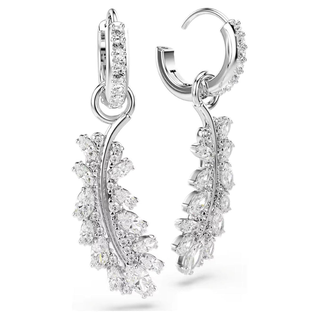 Niche Jewellery Swarovski Vienna feather earrings in rhodium plating with white mixed-cut crystals on hoop backs.