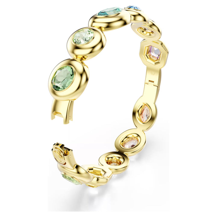 Niche Jewellery Swarovski Gema bangle featuring mixed cut multicoloured crystals set in gold tone plated metal