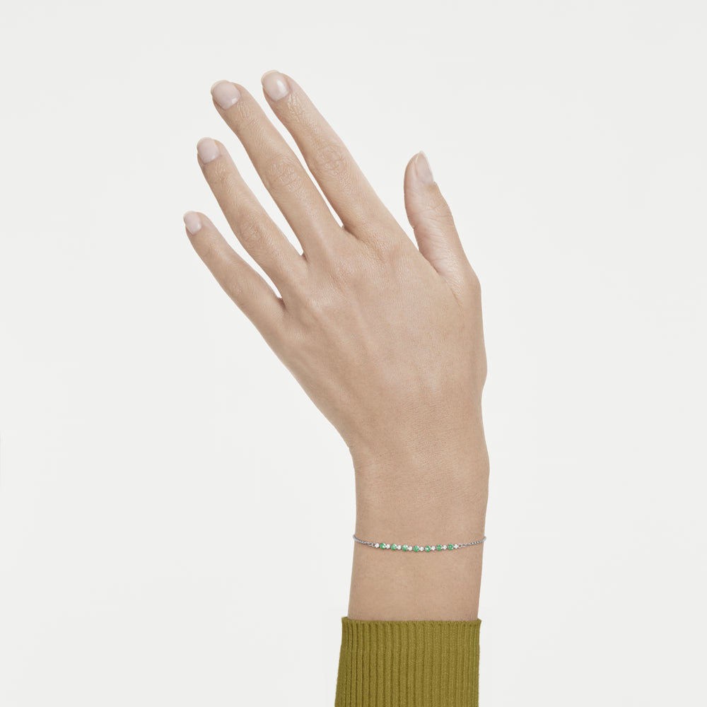 Niche Jewellery Swarovski Matrix bracelet featuring round green and white crystals on a rhodium-plated chain on wrist