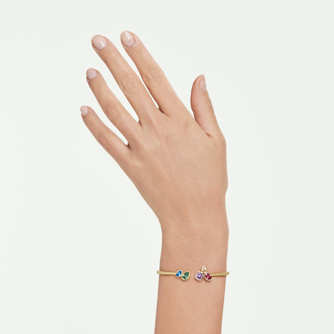 Niche Jewellery Swarovski Imber bangle featuring multicoloured mixed-cut crystals on an 18K gold-finished band.