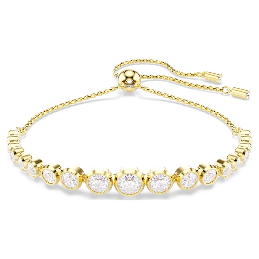 Niche Jewellery Swarovski Imber tennis bracelet with round white crystals in gold-tone bezel settings and sliding clasp
