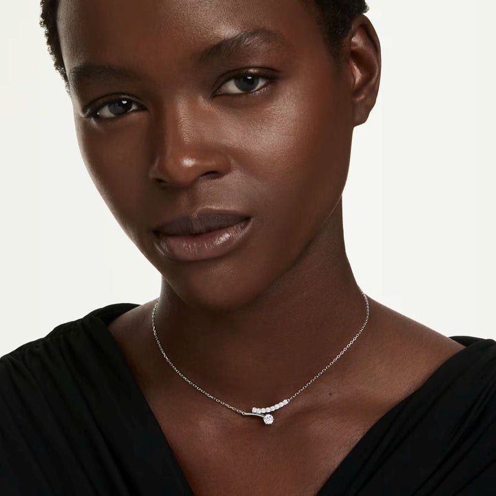 Niche Jewellery Swarovski Matrix necklace featuring round-cut white crystals on a rhodium-plated chain on a model.