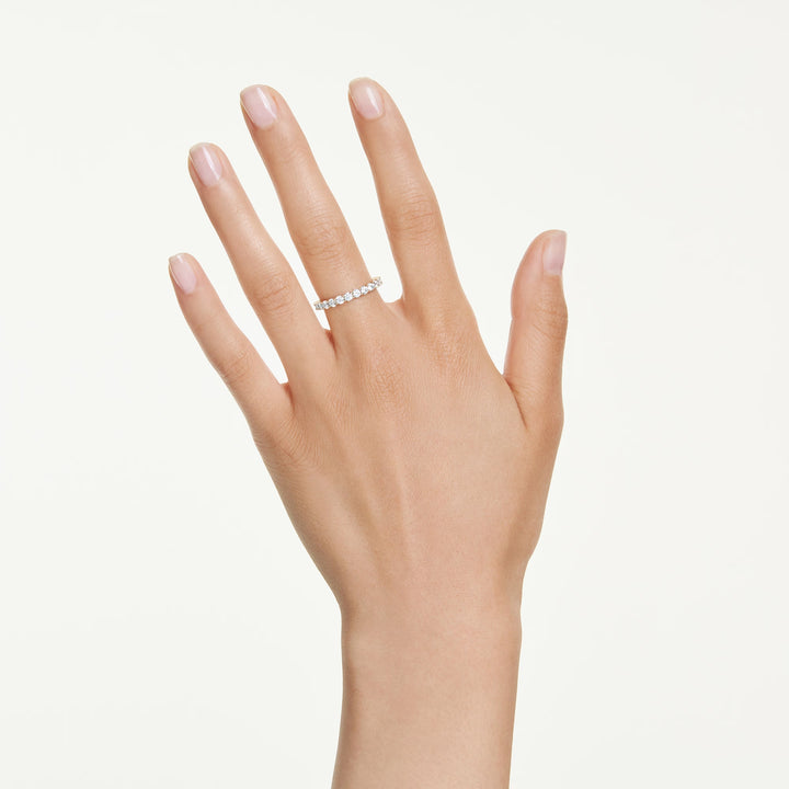 Niche Jewellery Swarovski Matrix Vittore band ring with round-cut white crystals on a gold-tone plated band on hand