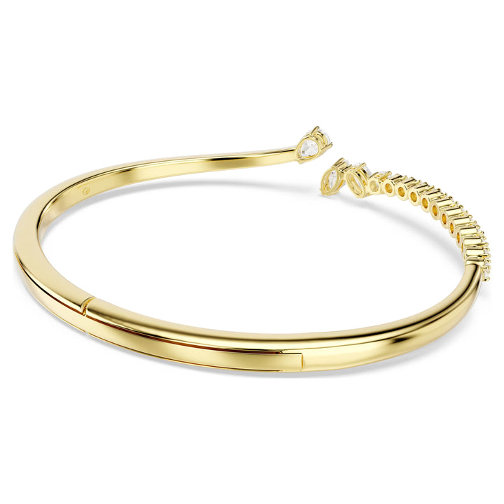 Niche Jewellery Swarovski Mesmera bangle featuring mixed-cut white zirconia stones set in an 18k gold-plated finish.