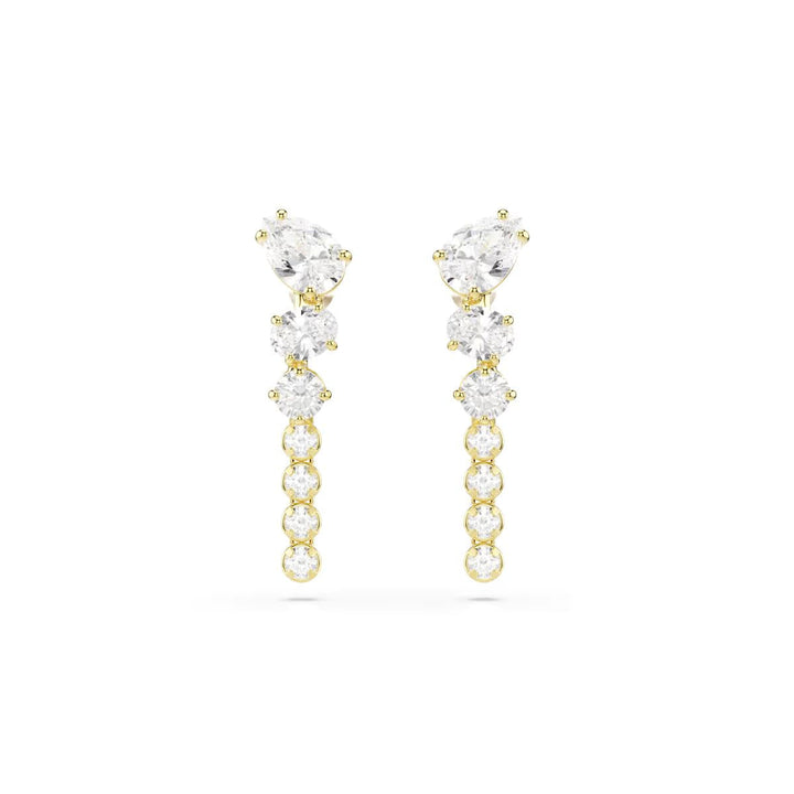 Niche Jewellery Swarovski Mesmera drop earrings featuring mixed-cut white zirconia stones in 18k gold-finished settings.