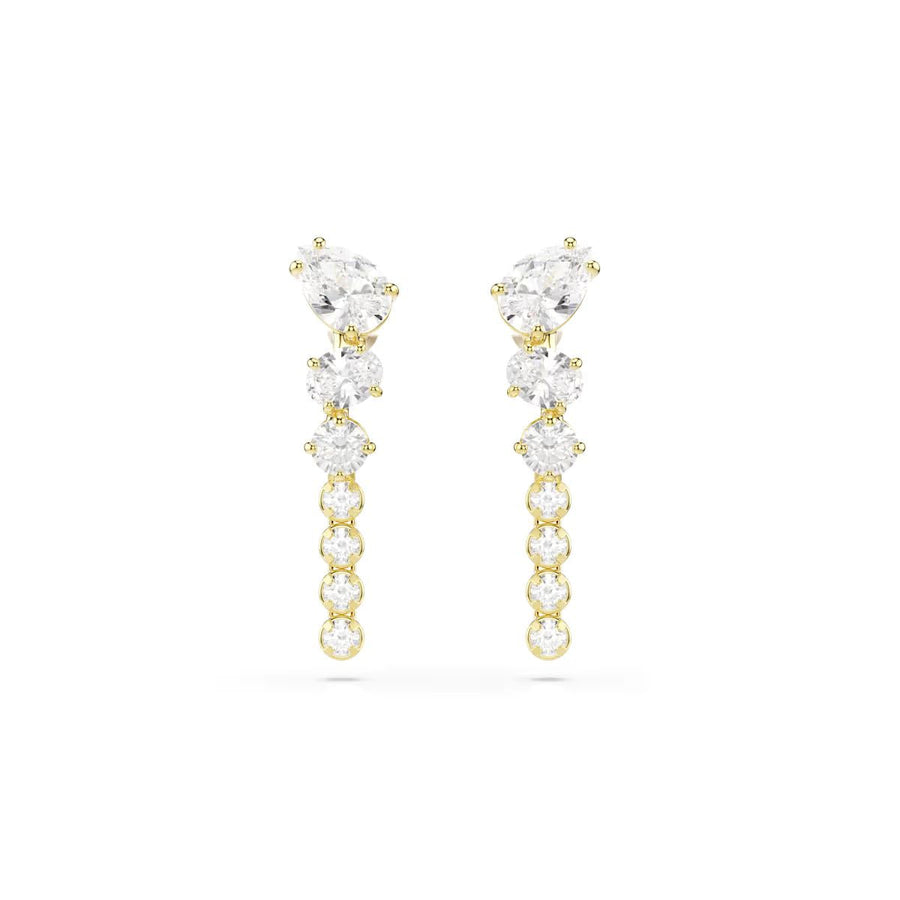 Niche Jewellery Swarovski Mesmera drop earrings featuring mixed-cut white zirconia stones in 18k gold-finished settings.