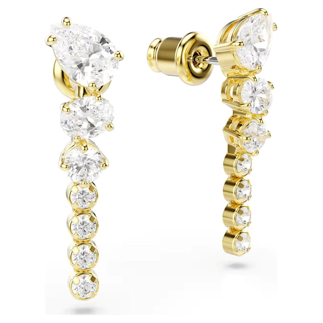 Niche Jewellery Swarovski Mesmera drop earrings featuring mixed-cut white zirconia stones in 18k gold-plated settings.