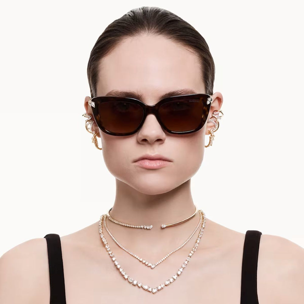 Niche Jewellery Swarovski Mesmera necklace with mixed cut white crystals and 18k gold finish on a model