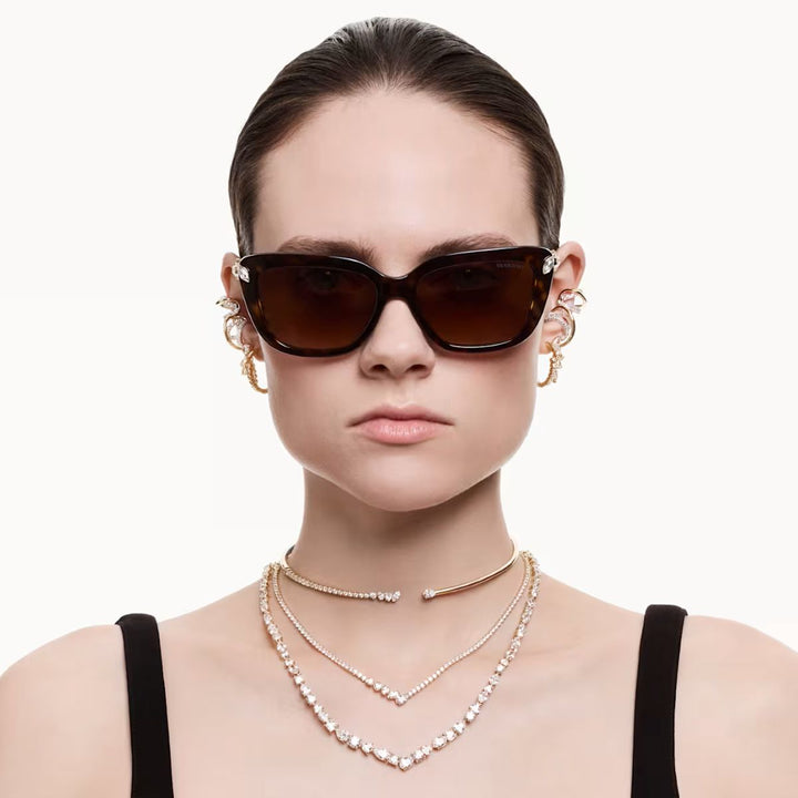 Niche Jewellery Swarovski Mesmera necklace with mixed cut white crystals and 18k gold finish on a model