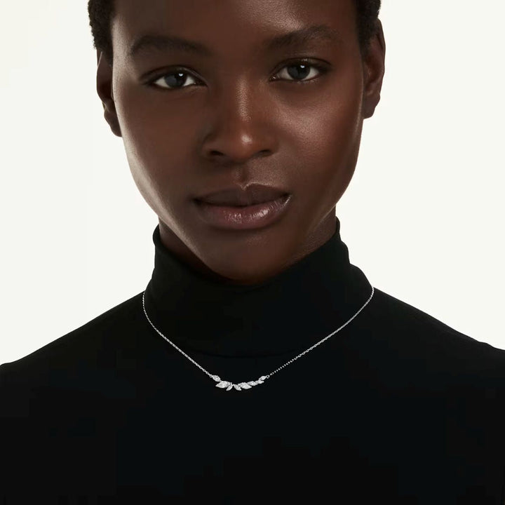 Niche Jewellery Swarovski Mesmera necklace featuring marquise-cut clear crystals on a rhodium-plated chain on a model