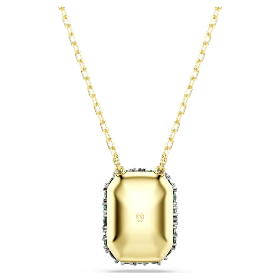 Niche Jewellery Swarovski Sublima pendant featuring an octagon-cut green crystal with 18K gold finish on a gold chain.