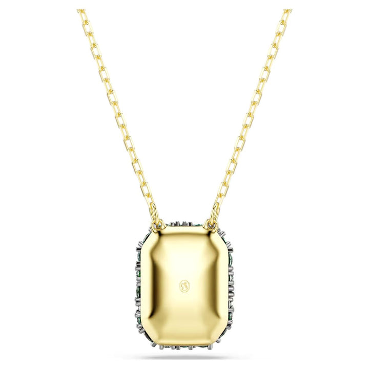 Niche Jewellery Swarovski Sublima pendant featuring an octagon-cut green crystal with 18K gold finish on a gold chain.