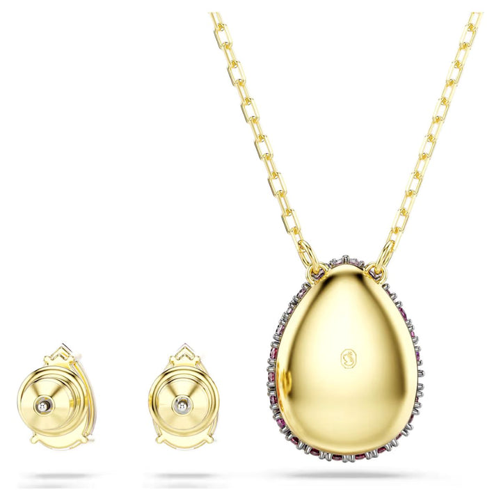 Niche Jewellery Swarovski Sublima set featuring a pear-cut red crystal pendant and matching earrings in gold finish.