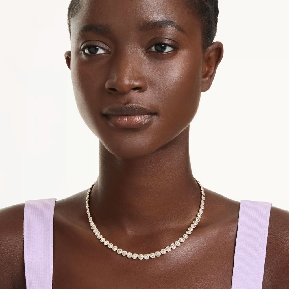 Niche Jewellery Swarovski Una Angelic necklace with round-cut crystals and gold-tone plating worn by a model