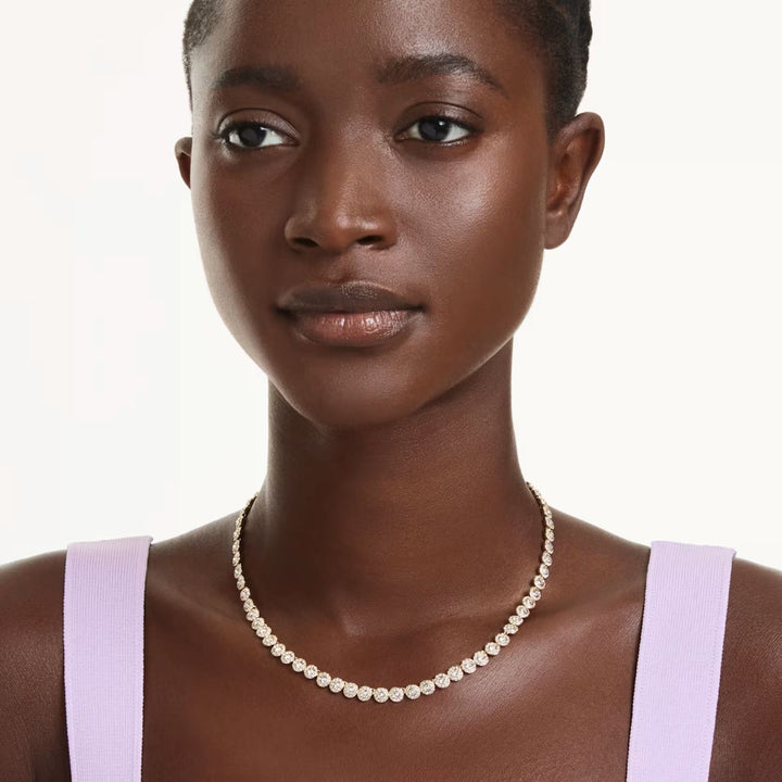 Niche Jewellery Swarovski Una Angelic necklace with round-cut crystals and gold-tone plating worn by a model