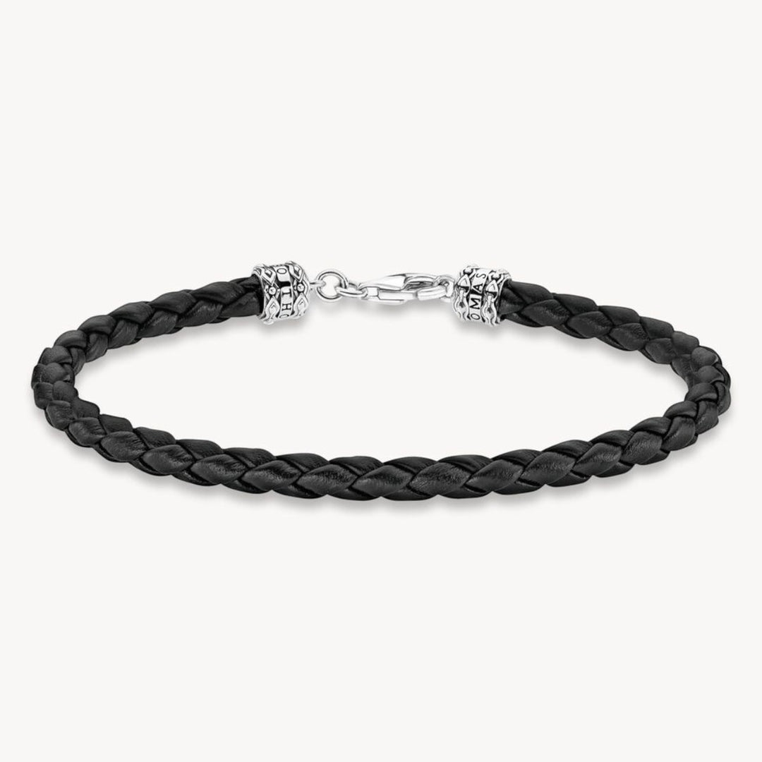 Thomas Sabo black braided leather bracelet with blackened 925 Sterling silver lobster clasp and decorative end caps.