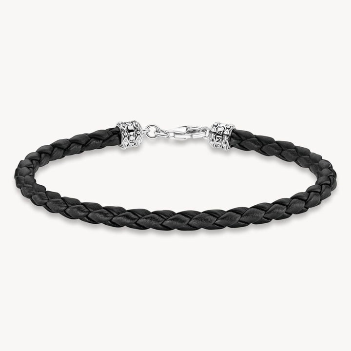 Thomas Sabo black braided leather bracelet with blackened 925 Sterling silver lobster clasp and decorative end caps.