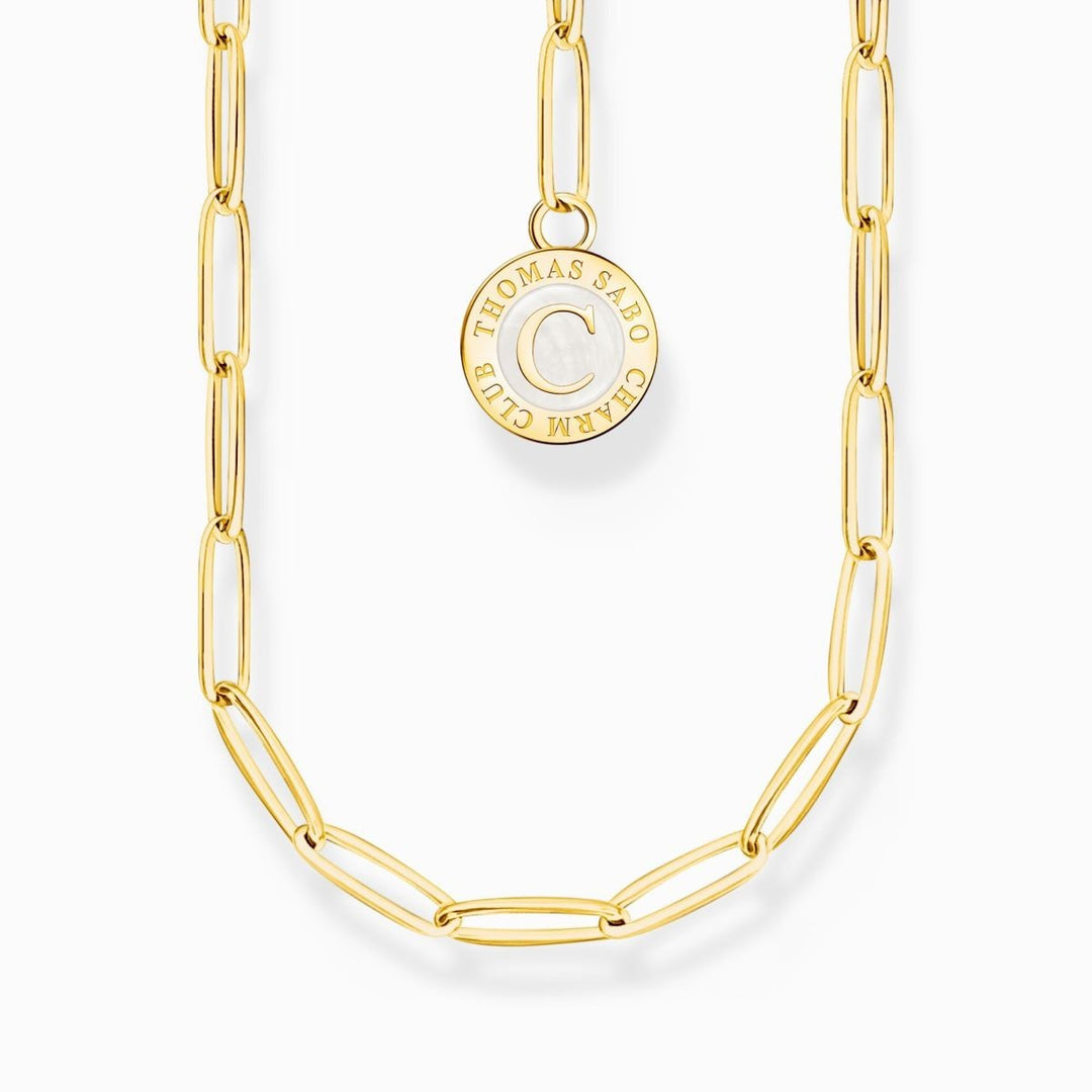 Niche Jewellery Thomas Sabo gold-plated sterling silver necklace with white Charmista disc charm featuring a 'C'.