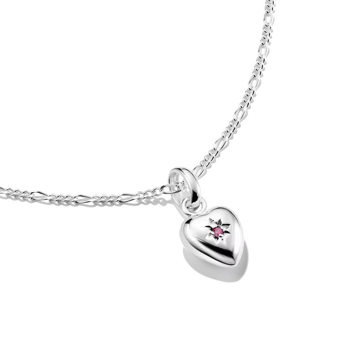 Thomas Sabo sterling silver heart charm pendant with engraved star and ruby on figaro chain.