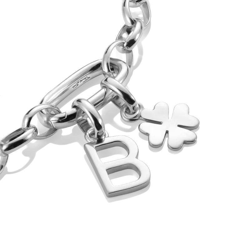 Thomas Sabo sterling silver lucky clover charm pendant with a delicate design, attached to a bracelet with a letter B charm.