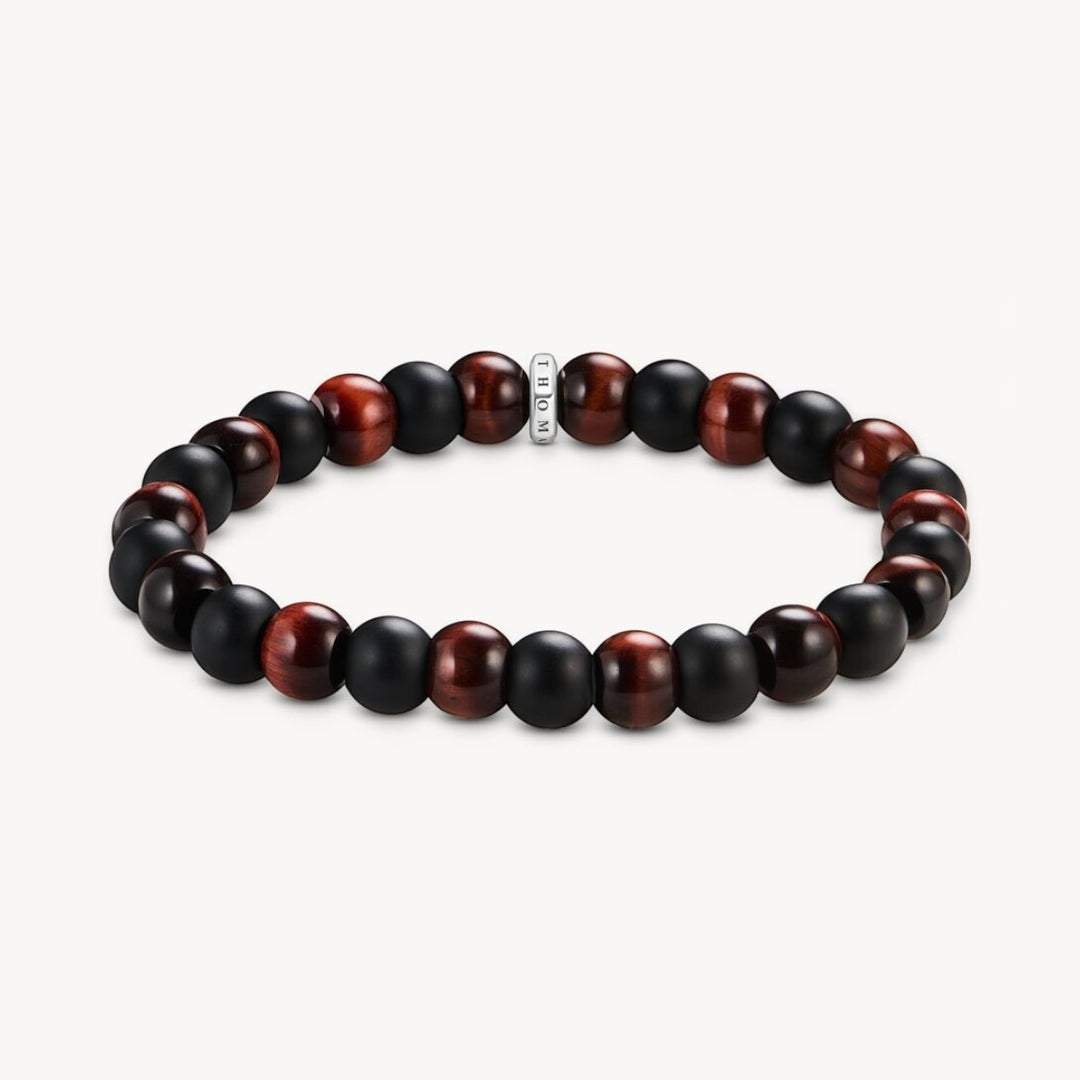 Thomas Sabo bracelet with matte black obsidian and red tiger's eye beads, featuring a Thomas Sabo logo ring.