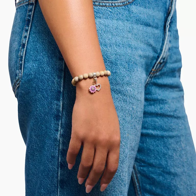 Niche Jewellery Thomas Sabo open heart charm pendant with white zirconia on a sterling silver bracelet.