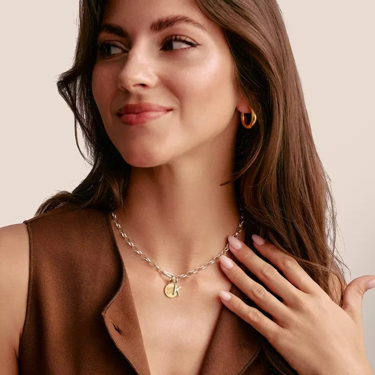 Niche Jewellery Thomas Sabo silver letter E charm on a chain necklace, minimalist design.