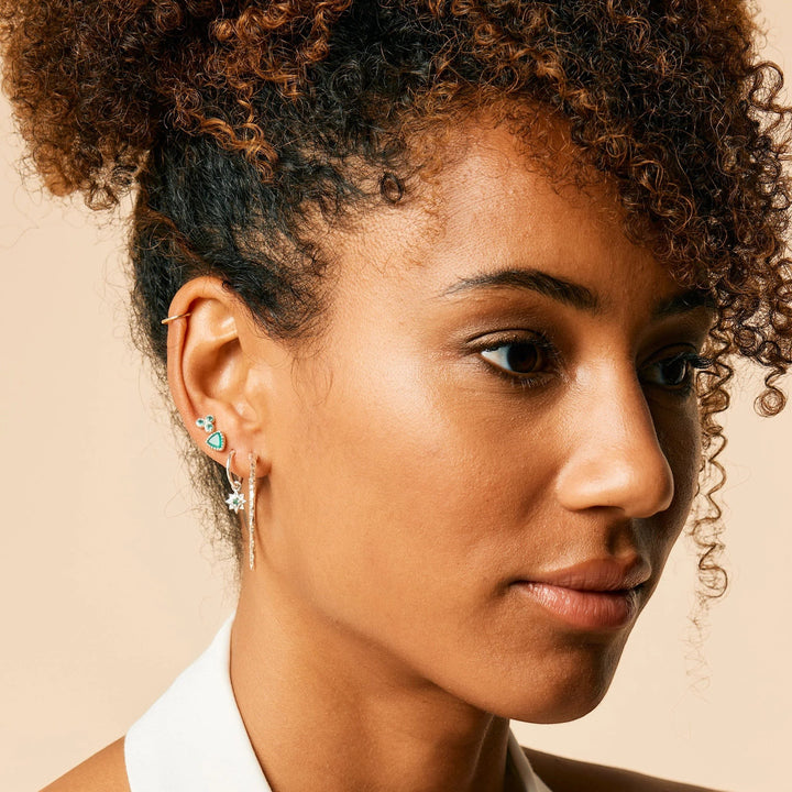 Niche Jewellery Charlotte's Web Threeni stud earrings featuring green onyx in recycled sterling silver on a model.