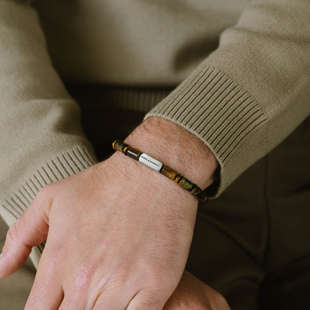Niche Jewellery Steel & Barnett tiger eye barrel bead bracelet with a brushed stainless steel accent on a man's wrist