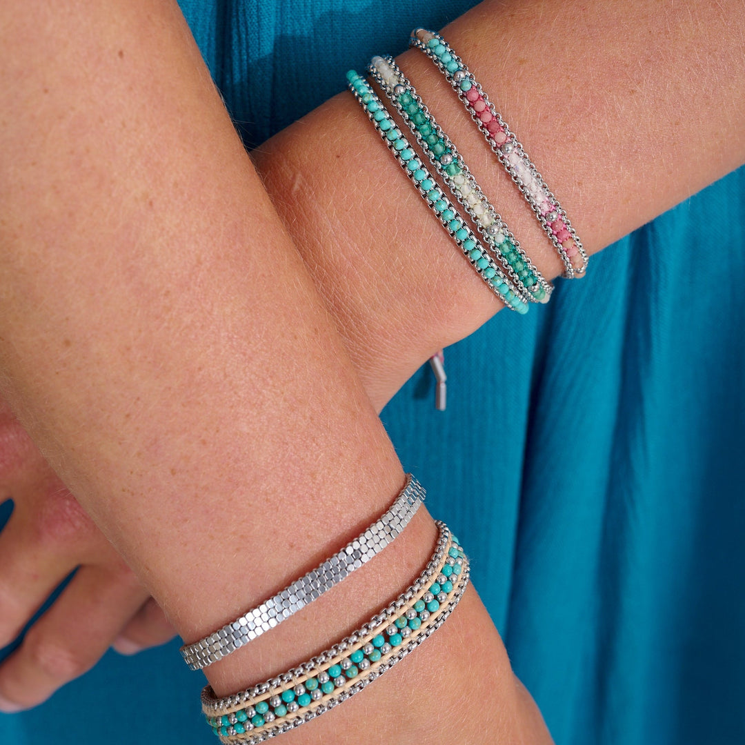 Niche Jewellery Boho Betty Zena turquoise howlite and silver-plated beaded bracelets worn on a wrist