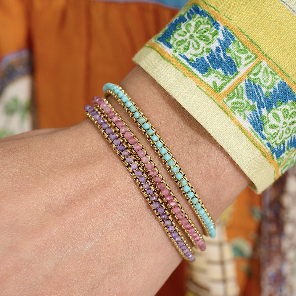 Niche Jewellery Boho Betty Zena bracelet stack featuring turquoise and purple beaded gold-plated chains on a wrist