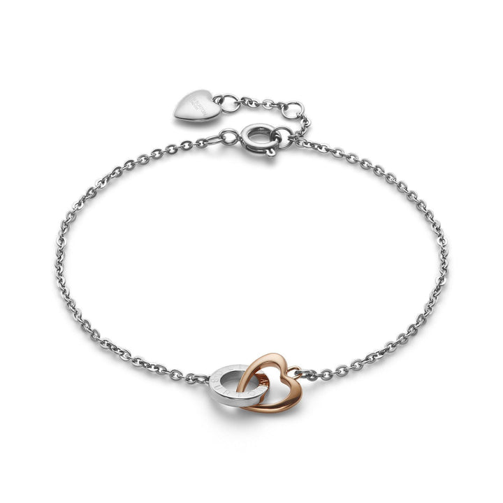 Niche Jewellery Olivia Burton two-tone silver and rose gold plated interlinking heart bracelet on a white background.