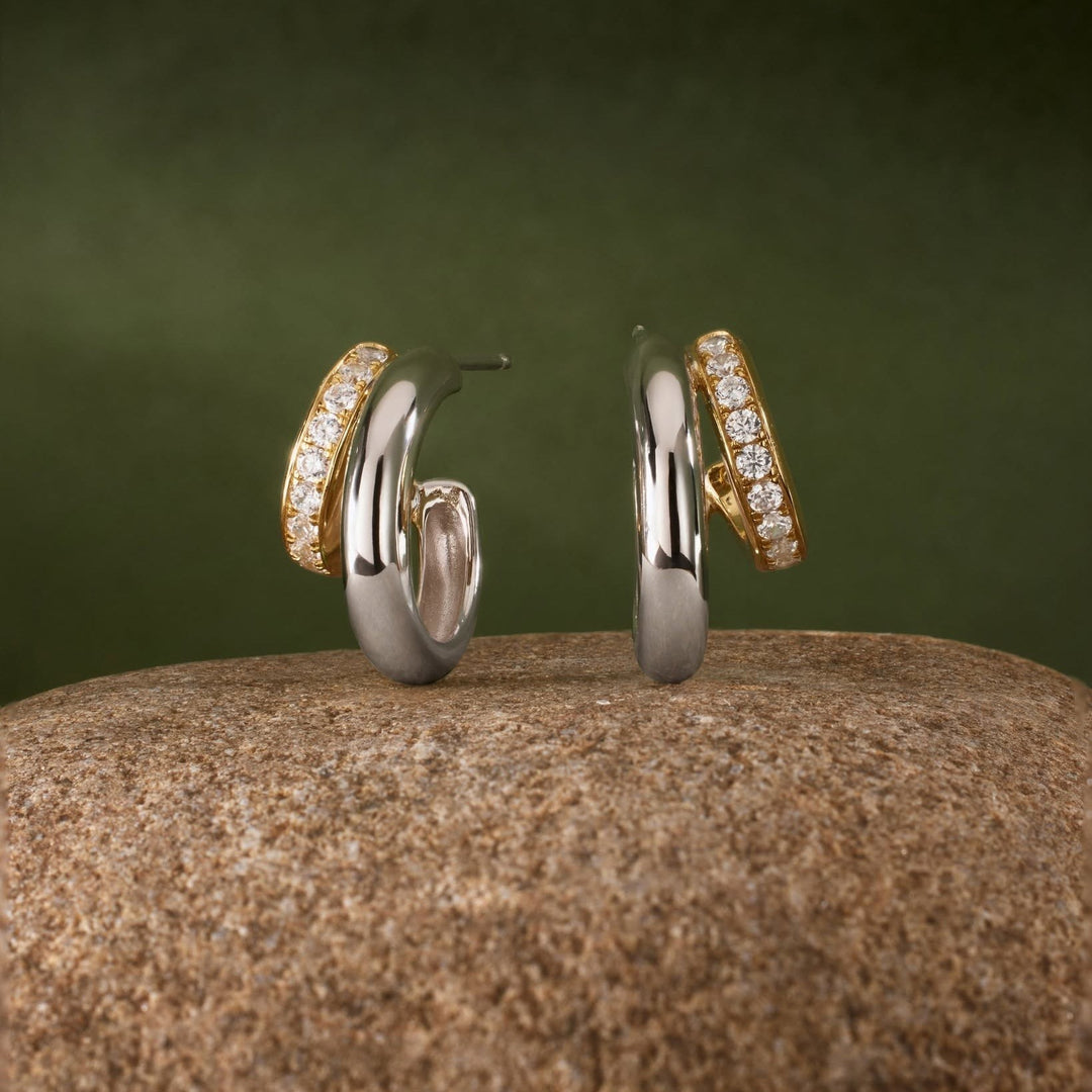 Niche Jewellery Ania Haie two-tone gold and silver hoop earrings featuring sparkling cubic zirconia studs