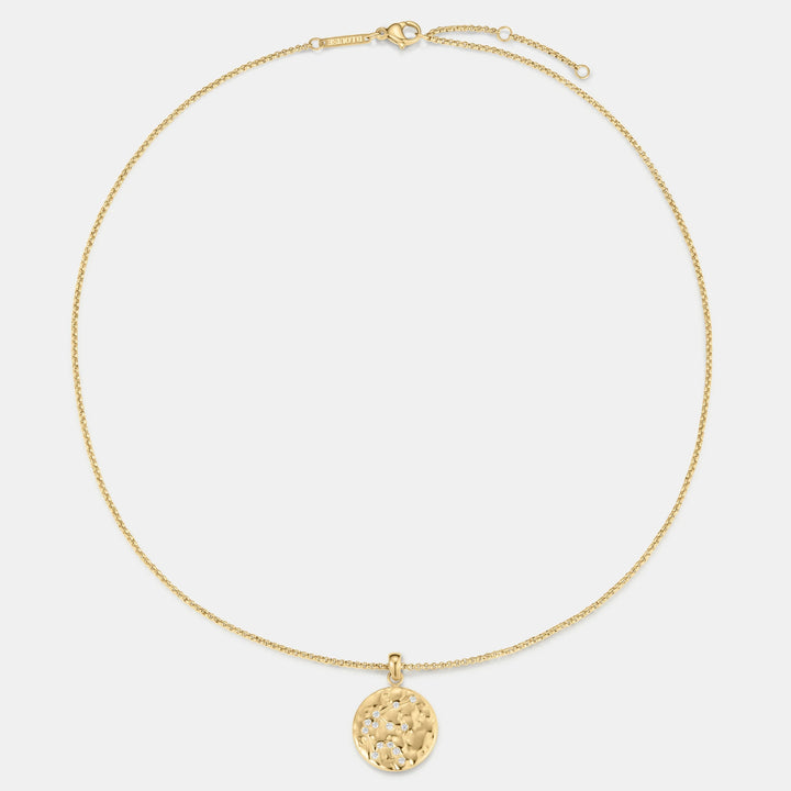 Niche Jewellery gold Aquarius zodiac talisman necklace with hammered finish and small diamonds.