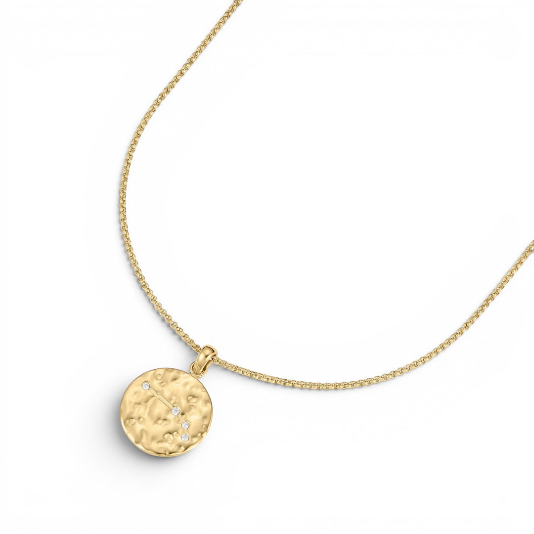 DLouise gold Aries zodiac talisman necklace with hammered finish and small diamonds.